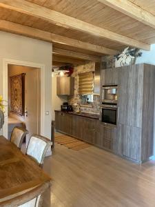 a kitchen with a table and a stove top oven at Villa with private pool and stunning sea view in Galaxidhion +11 photos