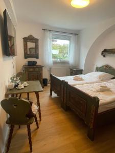 Postel nebo postele na pokoji v ubytování Apartmenthaus Wilder Mann