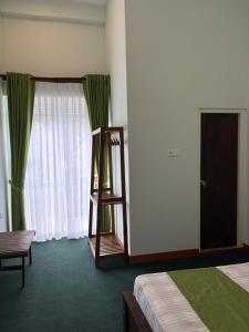 Ένα ή περισσότερα κρεβάτια σε δωμάτιο στο Mount Rivera