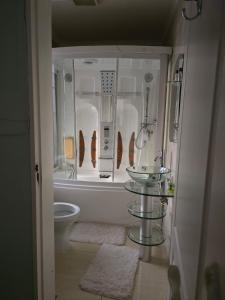 a bathroom with a sink and a toilet at Apelles Palace Guest House - Staycation of choice - Home away from yours in Tlokweng