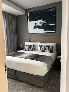 Postel nebo postele na pokoji v ubytování The Capital on the Park Sandton Living Perfected + 16 fotografií