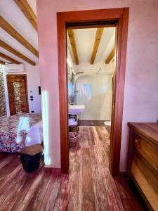 a bedroom with a bed and a sink and a mirror at Agriturismo Tamellini in Soave +107 photos
