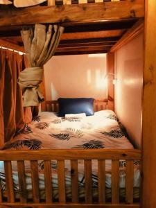 a bedroom with a wooden bunk bed in a room at Dalat Peace Backpackers Hostel in Da Lat +39 photos