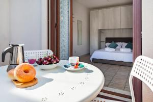 Ένα ή περισσότερα κρεβάτια σε δωμάτιο στο Helios Vacanze