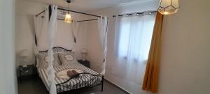 Ένα ή περισσότερα κρεβάτια σε δωμάτιο στο Maison Job