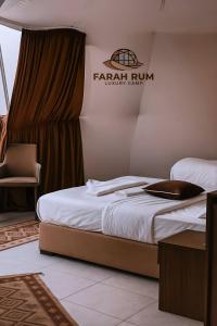 a bedroom with a bed and a chair in it at FARAH RUM LUXURY CAMP & Bubbles Hotel in Wadi Rum