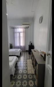 Postel nebo postele na pokoji v ubytování Urban Nest + 7 fotografií