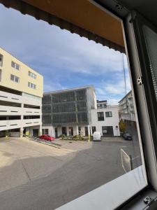 a view of a building from a window at Central and Spacious Apartment with All Amenities in Nitra