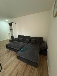 a living room with a couch and a bed at Central and Spacious Apartment with All Amenities in Nitra