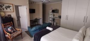 a living room with a bed and a couch at Mila's at Panorama in Panorama