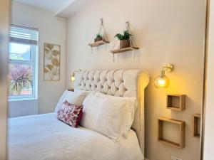 Ένα ή περισσότερα κρεβάτια σε δωμάτιο στο The Palms at No10 - Spacious and Family Friendly