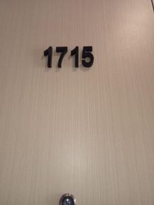 a clock on the wall with the number at City & River Views near Royal Palace and Watphnom in Phnom Penh