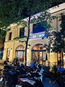 a group of motorcycles parked in front of a building at City & River Views near Royal Palace and Watphnom in Phnom Penh