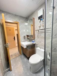 a bathroom with a toilet and a sink at City & River Views near Royal Palace and Watphnom in Phnom Penh