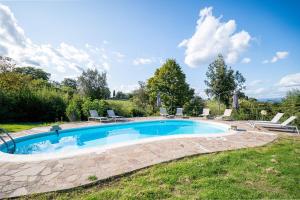 an image of a swimming pool in a yard at Pieve Vecchia, Luxury Tuscan Retreat with Spa in Campagnatico