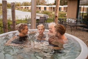 a group of people in a hot tub at Hofparken Wiltershaar in Winterswijk