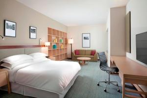 Ένα ή περισσότερα κρεβάτια σε δωμάτιο στο Ormond Sandakan