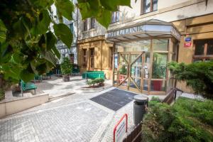 an empty street in a city with a building at Hotel Lunik in Prague