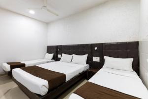 Postel nebo postele na pokoji v ubytování Hotel Ajwa