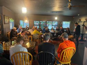 a group of people sitting at tables in a restaurant at Nourish Reefton & Wilsons Hotel in Reefton +8 photos