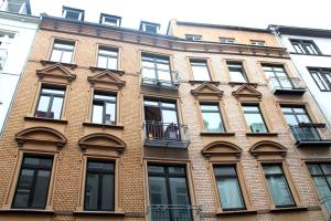 a brick building with windows on the side of it at City Residences Koblenz in Koblenz