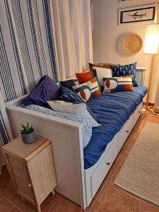 カルロフォルテにあるMy Octopus Houseのベッド(多くの枕付)