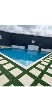 a swimming pool on the roof of a building at MM Luxury 3 bedroom Duplex Terrance in Aja