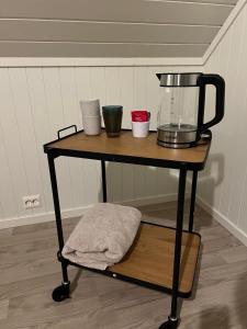 a table with a blender on top of it at Lofoten - Spacious Room in Vestvågøya