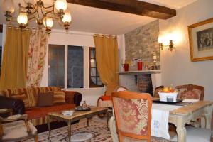 a living room with a couch and a table at Haut du Blanc in Le Blanc