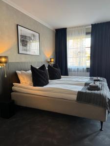 Postel nebo postele na pokoji v ubytování Central Hotellet Tierp