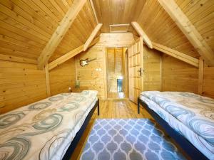 Un pat sau paturi într-o cameră la Vikendice Biocinovici