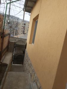 a stairway leading to a building with a window at Casa V in Tulcea