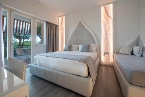 Postel nebo postele na pokoji v ubytování DIAMOND SUITE