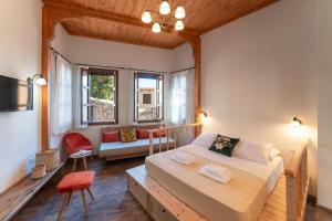 a bedroom with a bed and a living room at Rodos Old Town Aqua Luxury House in Rhodes Town +22 photos