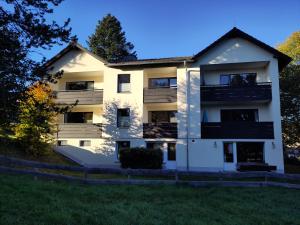 an apartment building with balconies on the side at Little Red Wood in Braunlage