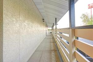 an empty hallway of a building with a hallway at Brookville Inn By OYO Near Dayton International Airport in Brookville