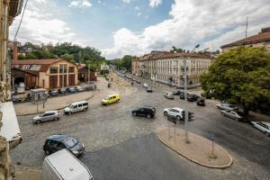 a city street filled with lots of cars in a city at Studio on Kopernyka street in Lviv