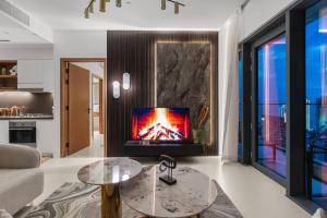 a living room with a fire place in the wall at Novity Luxury Vida Marina 2BR Sea View 40th Floor in Dubai