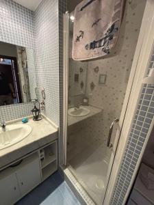 a bathroom with a shower and a sink at El Mocan Apartment Palm Mar in Palm-mar