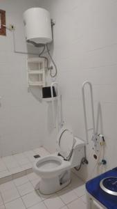 a bathroom with a white toilet and a sink at شركة العييري للشقق المخدومة - إقتصادي Al-Eairy Serviced Apartments Company in Al Hofuf