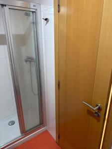 a bathroom with a shower with a glass door at Y&To in Grao de Castellón