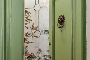 a door with a painting of a plant on it at Passera Royal Suite in Florence