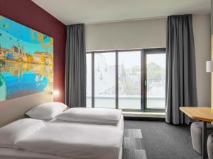 Ένα ή περισσότερα κρεβάτια σε δωμάτιο στο B&B HOTEL Zwickau