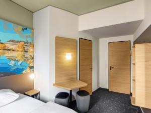 Ένα ή περισσότερα κρεβάτια σε δωμάτιο στο B&B HOTEL Zwickau +21 φωτογραφίες