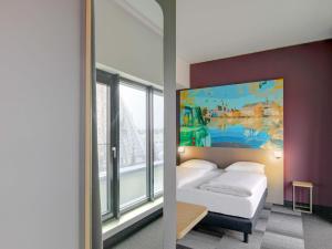 Ένα ή περισσότερα κρεβάτια σε δωμάτιο στο B&B HOTEL Zwickau