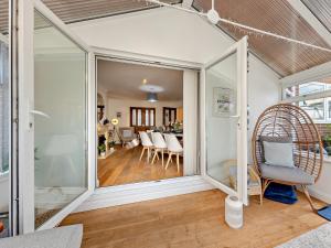 a living room with a large sliding glass door at 4 Bed in Llandudno 89703 in Deganwy