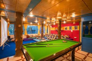 a billiard room with a green pool table at goSTOPS Kasol in Kasol