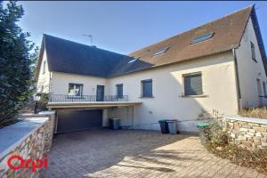 a large white house with a large driveway at L'Arbre de Vie in Montmarault