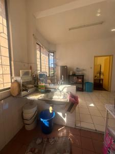 a kitchen with a sink and a counter top at Sweet home Beverly hills in Penampang