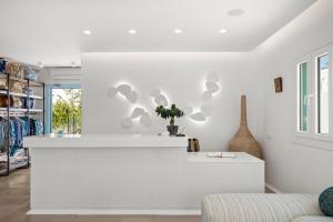 a white living room with a white wall at Majo Suites Hotel in Agia Anna Naxos +238 photos